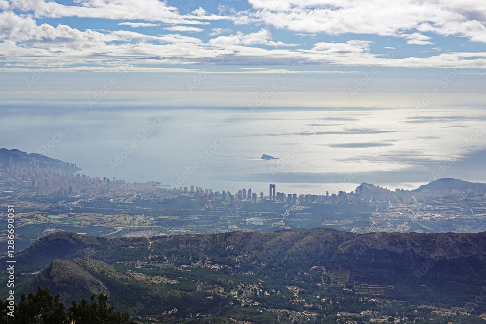 The panorama opening from the pick Puig Camapan in the direction of Benidorm and sea, Spain The panorama opening from the pick Puig Camapan in the direction of Benidorm and sea, Spain