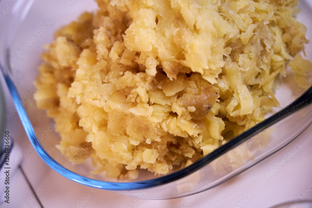 man crushes boiled potatoes for mashed potatoes man crushes boiled potatoes for mashed potatoes