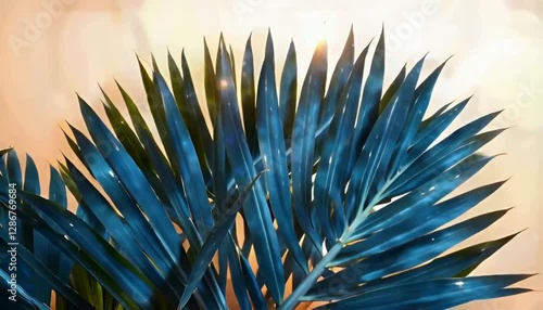 an azure palm frond against a warm, sunlit background.