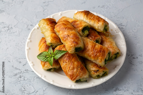 Obraz na płótnie Turkish Tepsi Boregi, Round Borek, Tray pastry (Turkish name; rulo borek - sigara boregi). Spinach Pie. w salonie