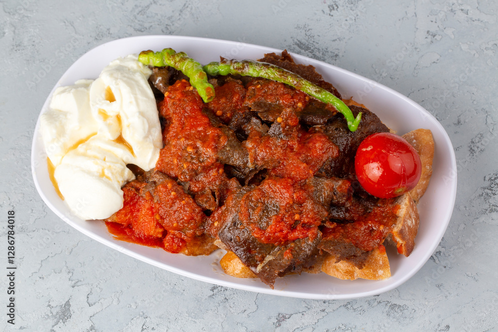 Meat doner menu, iskender menu on plate, turkish special meat doner, food, special menu (Turkish name; pilav üstü et doner) Meat doner menu, iskender menu on plate, turkish special meat doner, food, special menu (Turkish name; pilav üstü et doner)