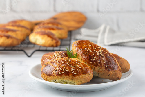 Obraz na płótnie Delicious Turkish food; dill cheese pastry, Turkish name; dere otlu peynirli pogaca w salonie