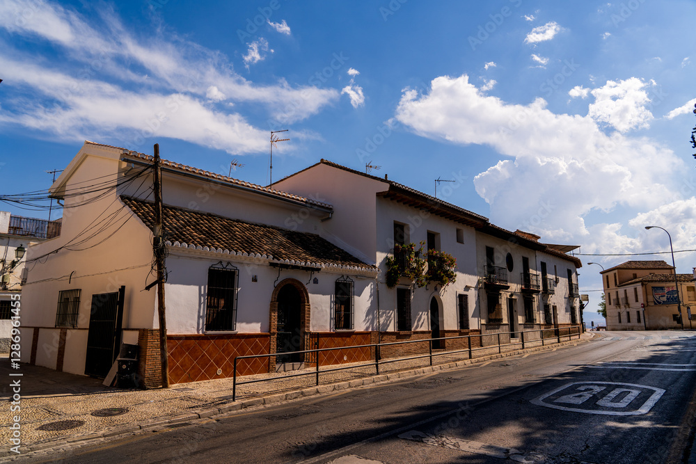 Tranquil Street near Albayzin in Granada: Whitewashed Andalusian Facades, Terracotta Roofs, and Timeless Southern Charm Beneath a Sunlit Spanish Sky Tranquil Street near Albayzin in Granada: Whitewashed Andalusian Facades, Terracotta Roofs, and Timeless Southern Charm Beneath a Sunlit Spanish Sky