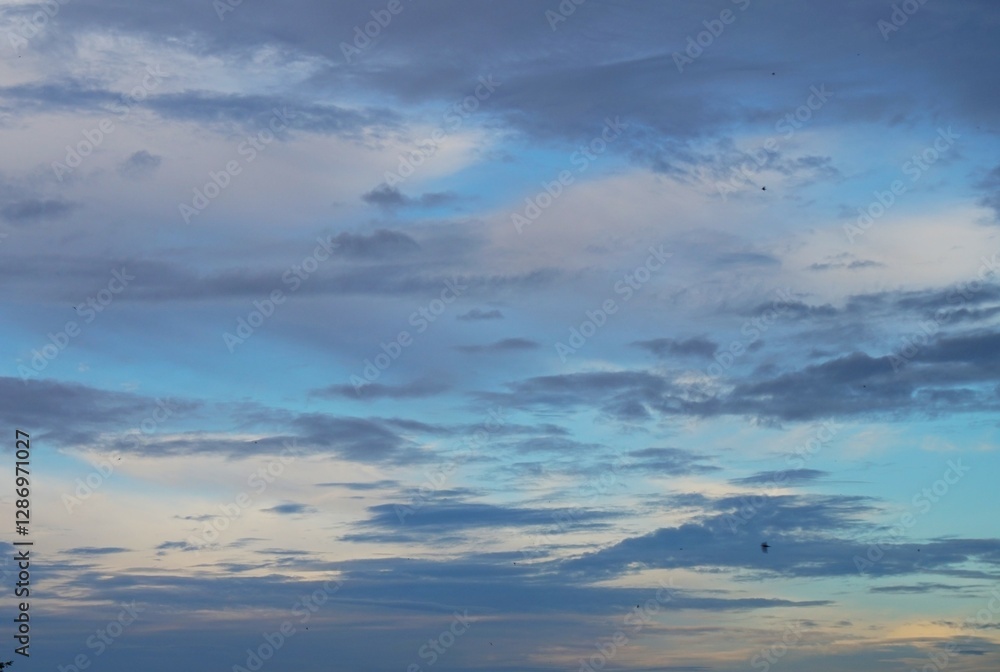 blue sky in the afternoon with white clouds and black clouds are a sign that night is coming blue sky in the afternoon with white clouds and black clouds are a sign that night is coming