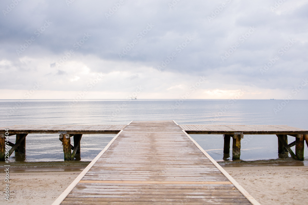 Wooden pier on empty beach by the Baltic sea in Sopot, Poland Wooden pier on empty beach by the Baltic sea in Sopot, Poland