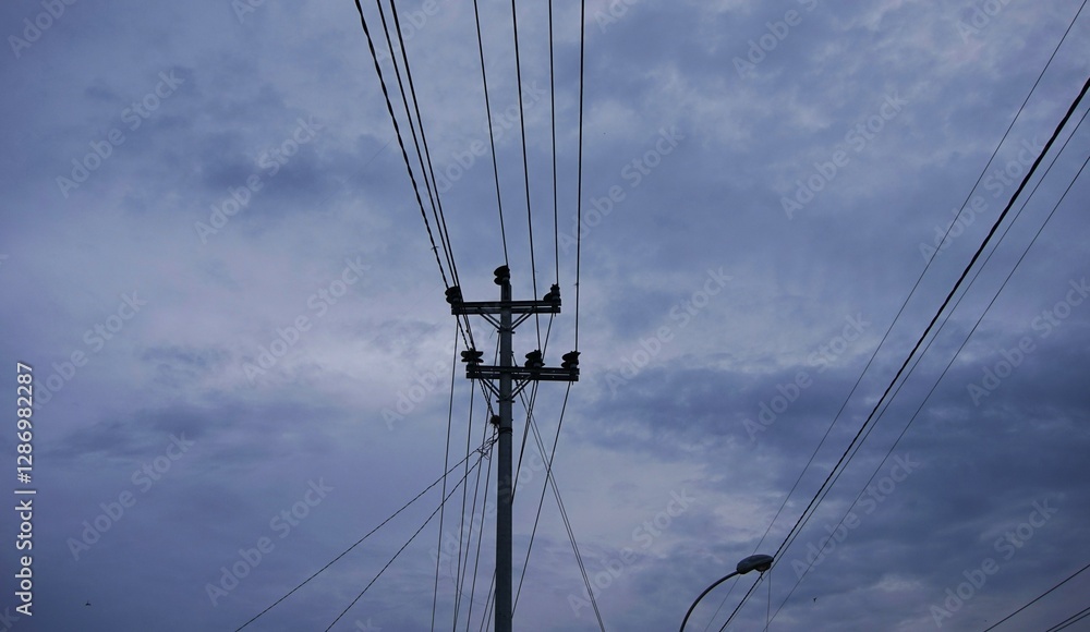 electric poles towering in the sky and the sky is clear with white clouds electric poles towering in the sky and the sky is clear with white clouds