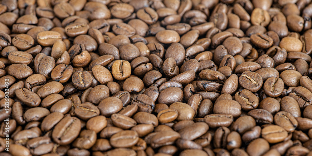 Roasted coffee beans as a background macro photo web size. Roasted coffee beans as a background macro photo web size.
