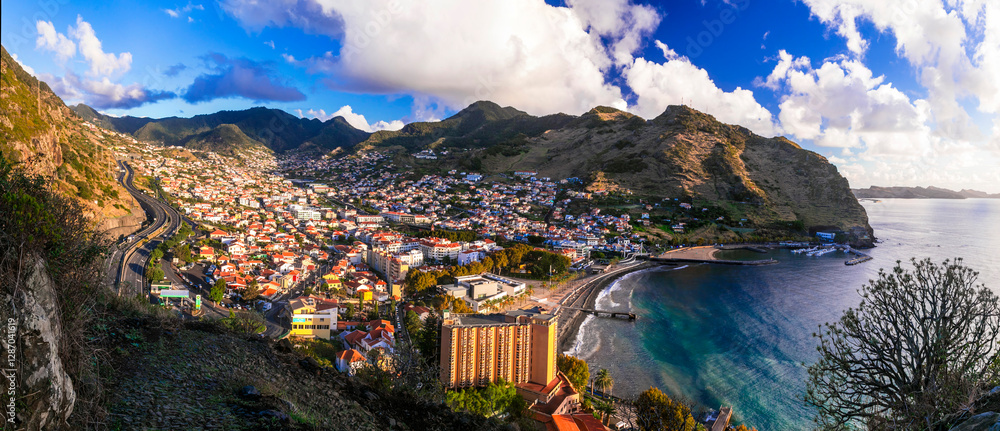 Fototapeta premium scenery of Madeira island, View of Machico town popular resort and beautiful bay with sandy beach. Eastern part of the island. Portugal travel.