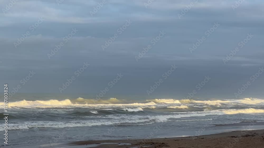 Calm Yet Powerful Waves Rolling onto the Shore Calm Yet Powerful Waves Rolling onto the Shore