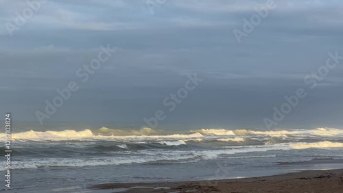 Calm Yet Powerful Waves Rolling onto the Shore 