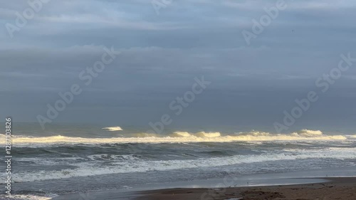 Majestic Morning Waves Illuminated by Soft Sunlight 