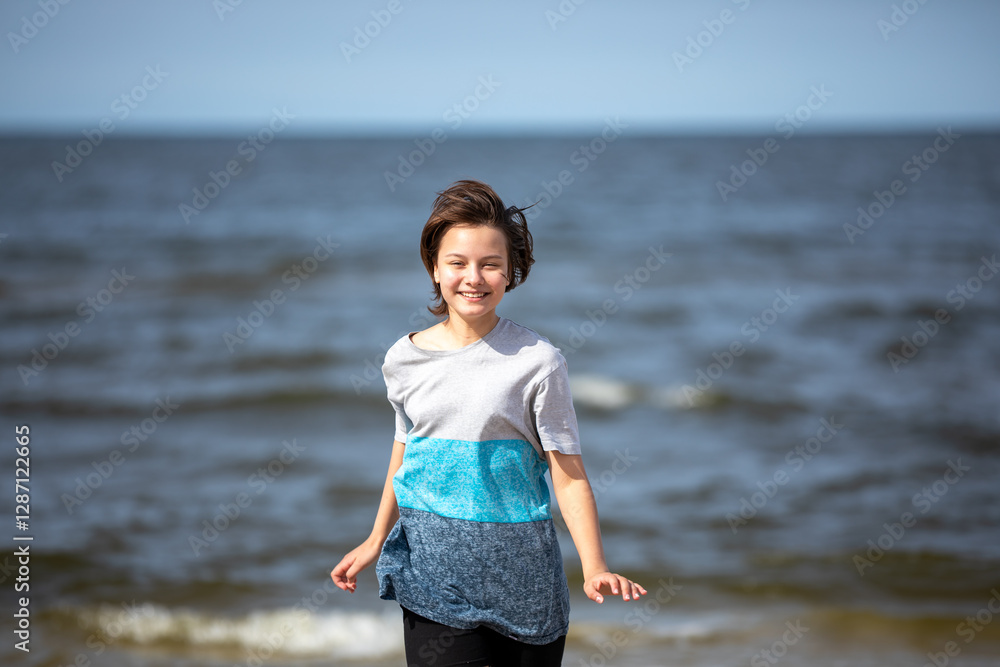 Beautiful girl walking at sea shore