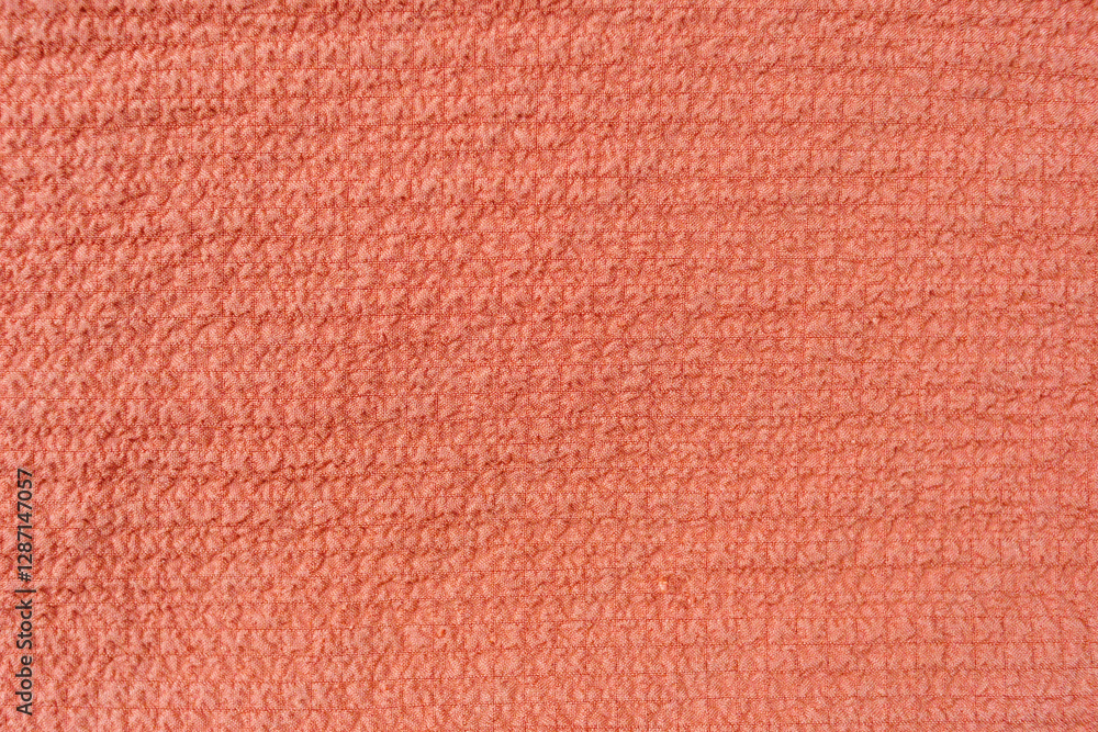 texture of thin viscose fabric of carrot color close-up texture of thin viscose fabric of carrot color close-up