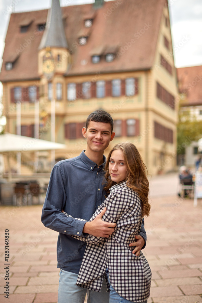 Fototapeta premium TEEN COUPLE LOVE STORY. Whispers of Love in German Splendor. Exploring German History with Love. Autumn Love Affair in German Elegance. Capturing the Essence of Teen Love