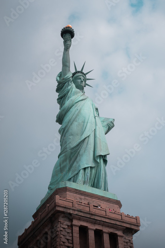 Close-up view of the Statue of Liberty in New York City, highlighting its iconic torch and face.