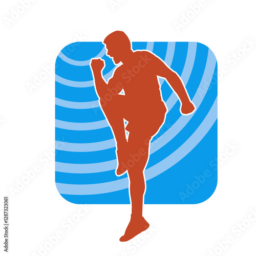 Silhouette of a sporty male in action pose at the gym. Silhouette of a slim man in aerobics workout pose.