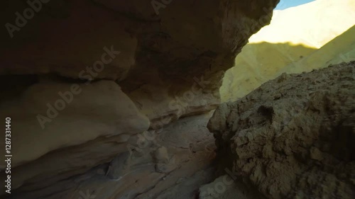 Explore the narrow passage in Golden Canyon, Death Valley National Park, California, a remarkable geological formation filled with adventure.