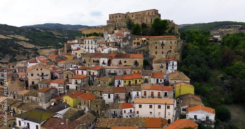 Rocca Imperial Town And Castle In Daytime In Calabria, Southern Italy. - aerial shot Rocca Imperial Town And Castle In Daytime In Calabria, Southern Italy. - aerial shot