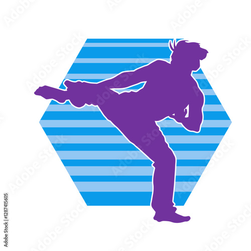 Silhouette of a male doing martial art kick pose. Silhouette of a martial art male doing kicking pose.