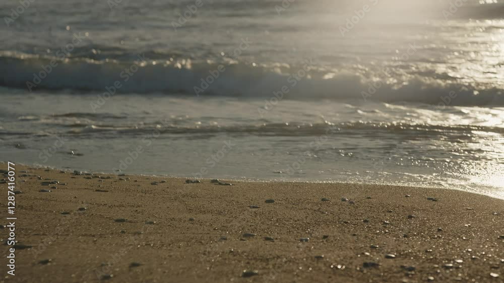 A close-up shot of the waves crashing onto the shore, with foam rising as the water meets the sand. The rhythmic flow of the ocean creates a soothing, natural beach scene. Cinematic 4K. A close-up shot of the waves crashing onto the shore, with foam rising as the water meets the sand. The rhythmic flow of the ocean creates a soothing, natural beach scene. Cinematic 4K.