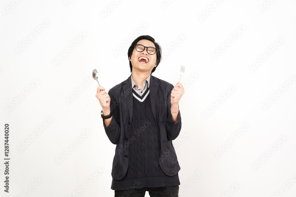 Happy gesture with holding fork and spoon Of Handsome Asian Man Isolated On White Background Happy gesture with holding fork and spoon Of Handsome Asian Man Isolated On White Background