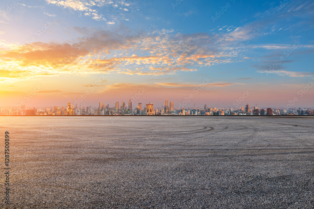 Asphalt road square and city skyline at sunrise in Shanghai