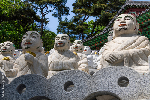 various Buddha statues in the Buddhist temple photo