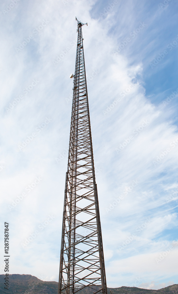 Antenna tower of telecommunication and Phone base station with TV and wireless internet antennas Antenna tower of telecommunication and Phone base station with TV and wireless internet antennas