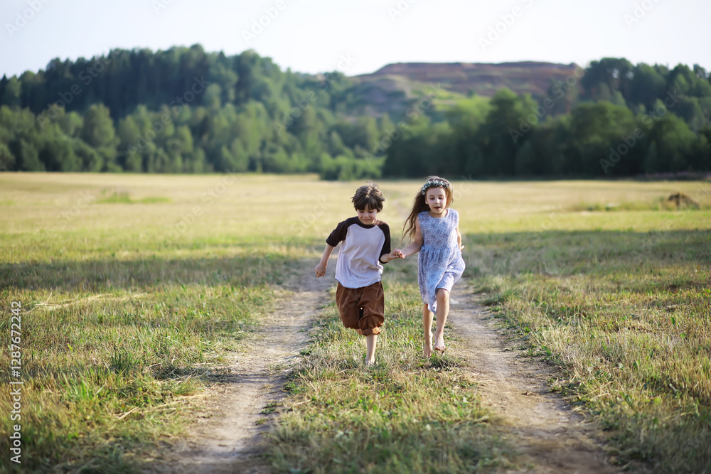Children walk in the summer in nature. Child on a sunny spring morning in the park. Traveling with children. Children walk in the summer in nature. Child on a sunny spring morning in the park. Traveling with children.