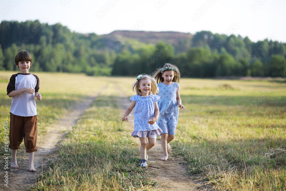 Children walk in the summer in nature. Child on a sunny spring morning in the park. Traveling with children. Children walk in the summer in nature. Child on a sunny spring morning in the park. Traveling with children.