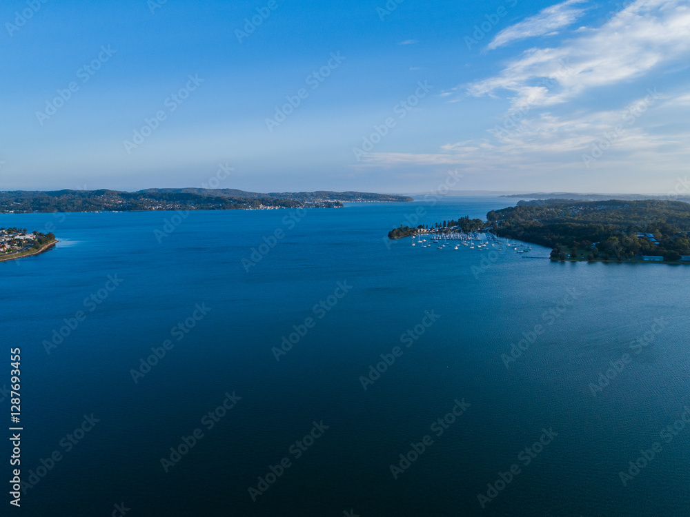 Deep blue water of Cockle bay with marina on distant shore seen from aerial view Deep blue water of Cockle bay with marina on distant shore seen from aerial view