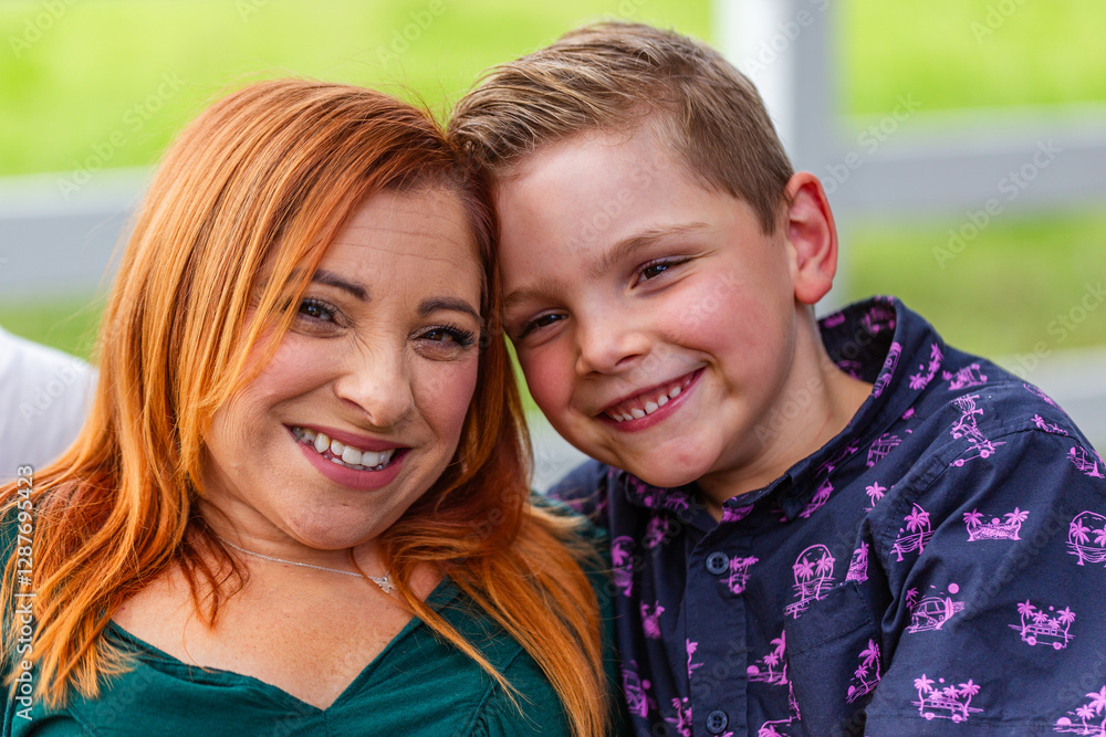 Portrait of smiling mother with son outdoors Portrait of smiling mother with son outdoors