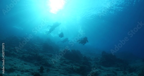 Wallpaper Mural silhouette  scuba divers sun beam shine rays underwater lady woman diver relaxing blue ocean scenery of people Torontodigital.ca