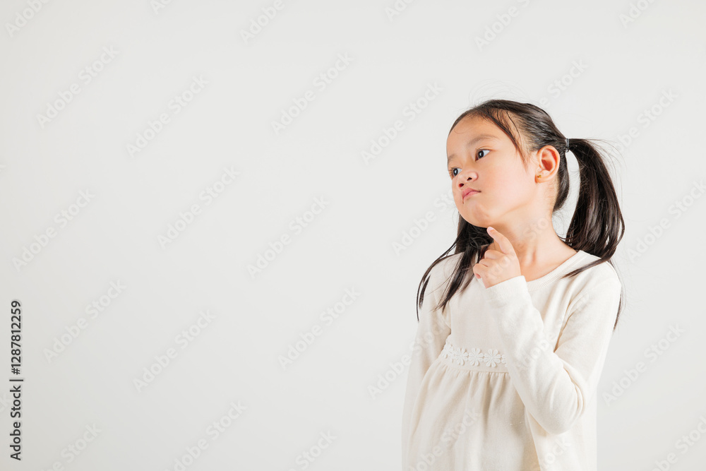 Portrait Asian kid girl deep in thought, standing with chin in hand, pondering a question. Studio shot isolated on white with ample copy space, kindergarten child portraying contemplative expression Portrait Asian kid girl deep in thought, standing with chin in hand, pondering a question. Studio shot isolated on white with ample copy space, kindergarten child portraying contemplative expression
