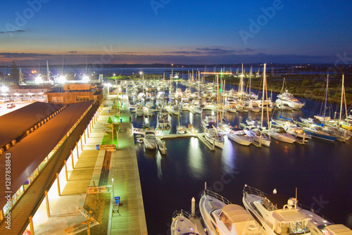 Looking down over a boat marina at twilight photo