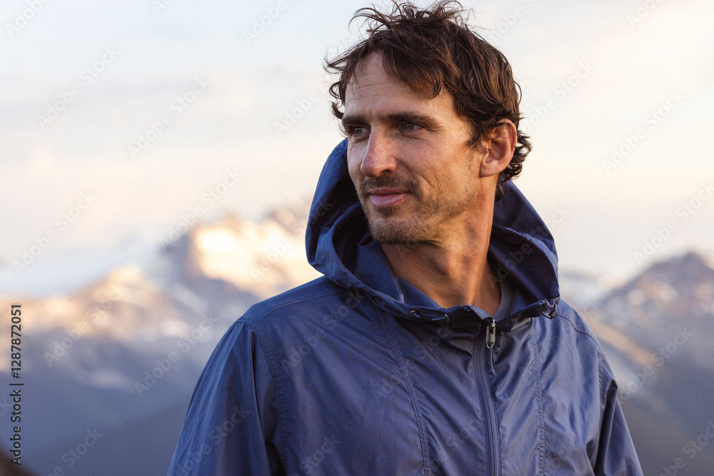 Close-up of a rugged, focused mountain man in natural sunlight. Close-up of a rugged, focused mountain man in natural sunlight.