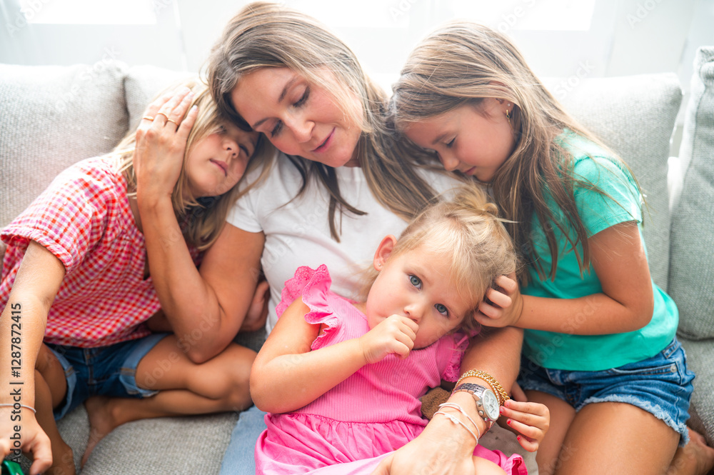Tired Three Daughters Resting with Mother on the Couch Tired Three Daughters Resting with Mother on the Couch