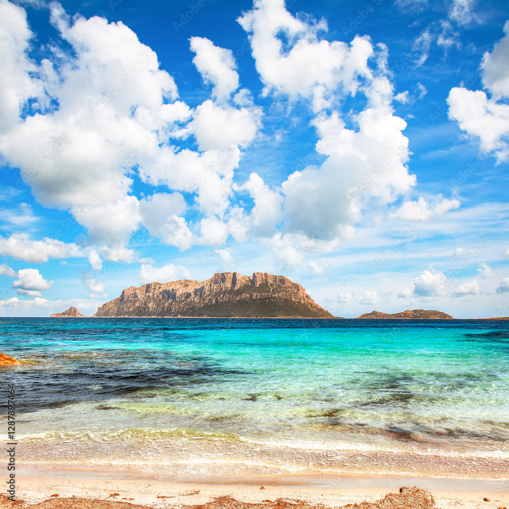 Superb azure water with rocks near beach Porto Taverna.