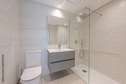 an image of a small guest bathroom with standing shower in mediterranean holiday home 