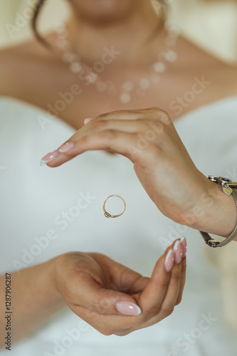 Wallpaper Mural The bride in her wedding dress threw the ring in her hands. In the photo it looks like levitation Torontodigital.ca