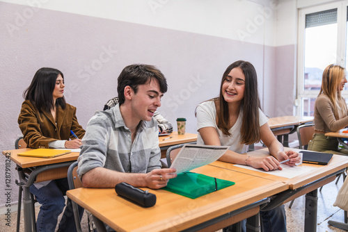 High school students collaborating on project during class photo