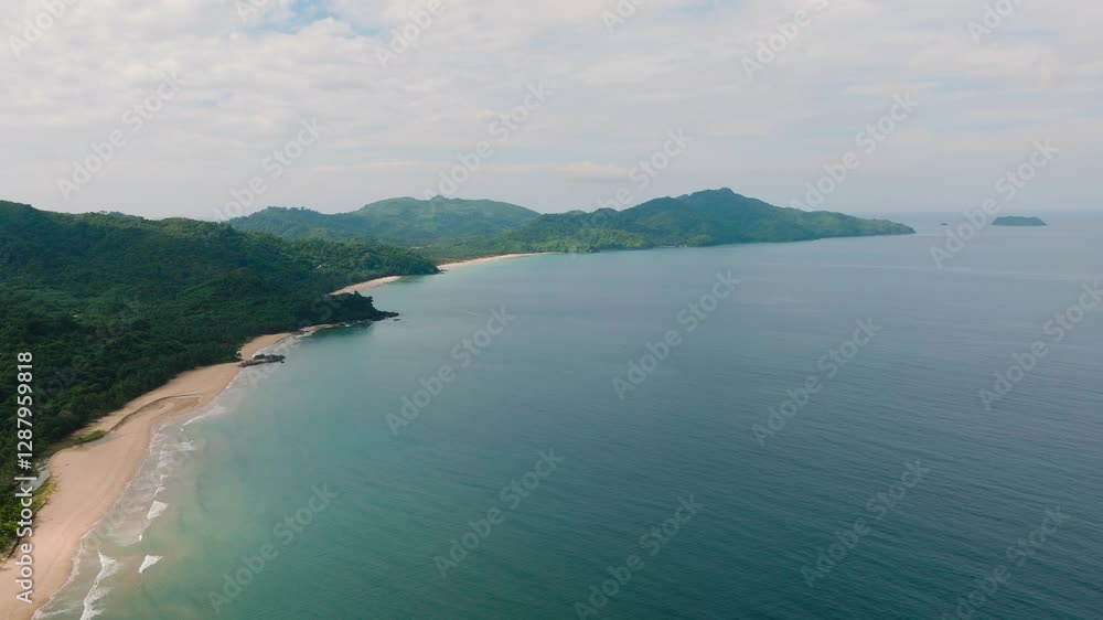 A pristine tropical beaches bordered by palm trees and green hills. El Nido, Palawan. Philippines. A pristine tropical beaches bordered by palm trees and green hills. El Nido, Palawan. Philippines.