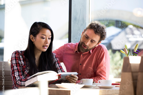 Wallpaper Mural Man and woman with book in a cafe Torontodigital.ca
