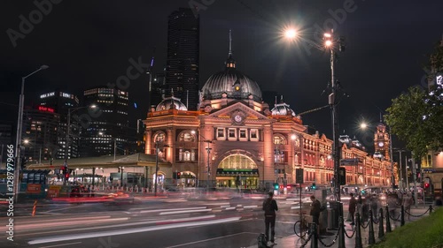 Flinders Street Train Station Time-Lapse at night with passing trams and cars