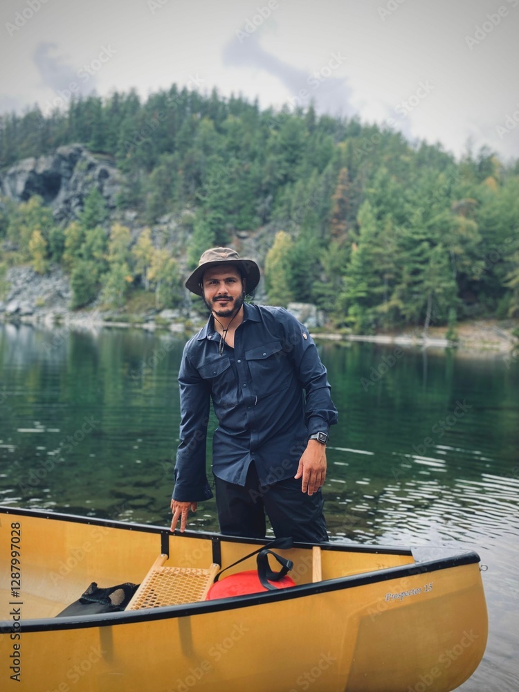 Man with Canoe by Serene Lake Man with Canoe by Serene Lake