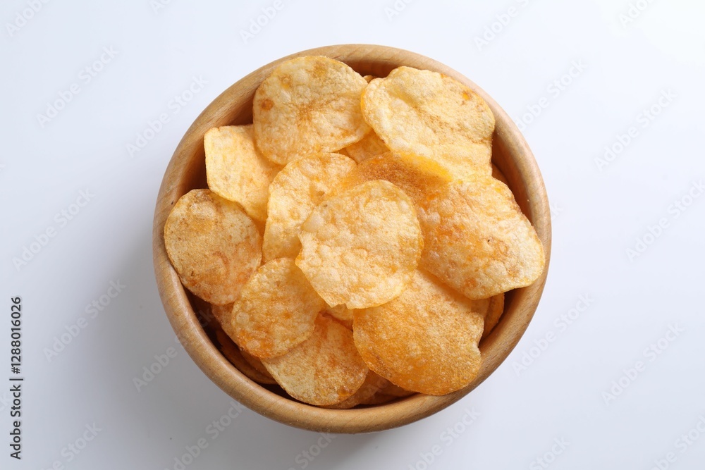 Tasty potato chips in bowl on white background, top view Tasty potato chips in bowl on white background, top view