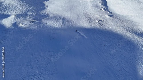Skiers going down the Alps