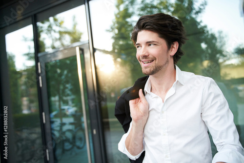 Happy businessman in the city photo