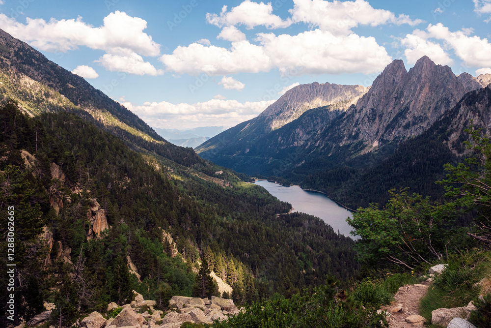 panoramic view of a mountain range with a lake in the valley, the sky is clear and the sun is shining brightly panoramic view of a mountain range with a lake in the valley, the sky is clear and the sun is shining brightly