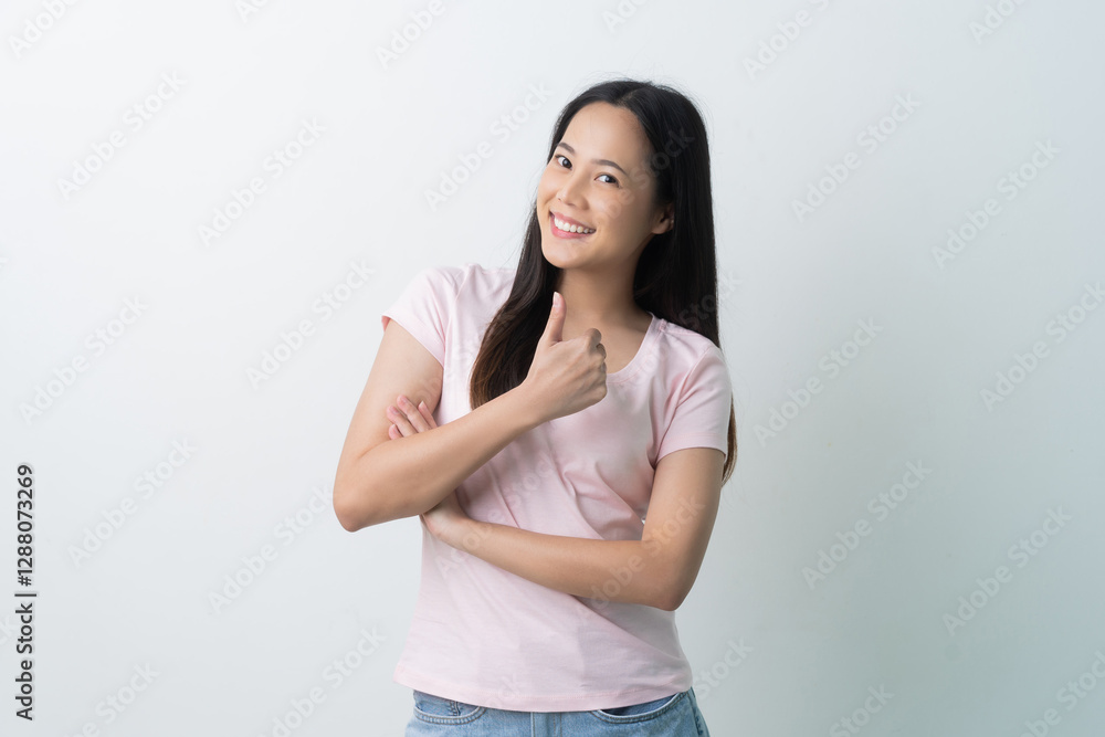 Woman feeling happy, doing thumbs up gesture Woman feeling happy, doing thumbs up gesture